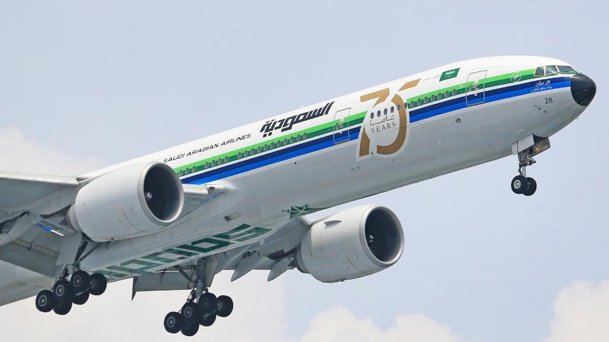 Saudi Arabian Airlines Boeing 777 taking off, marking 75 years of operation.