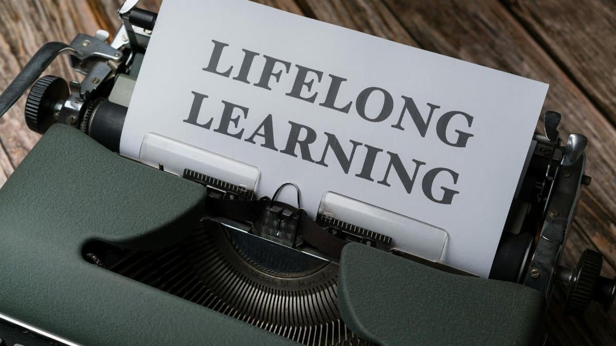 A classic typewriter displaying 'Lifelong Learning' on paper, symbolizing ongoing education.