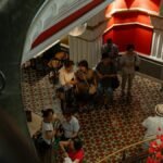 Tourists explore a vibrant indoor historic site in Sydney, Australia.