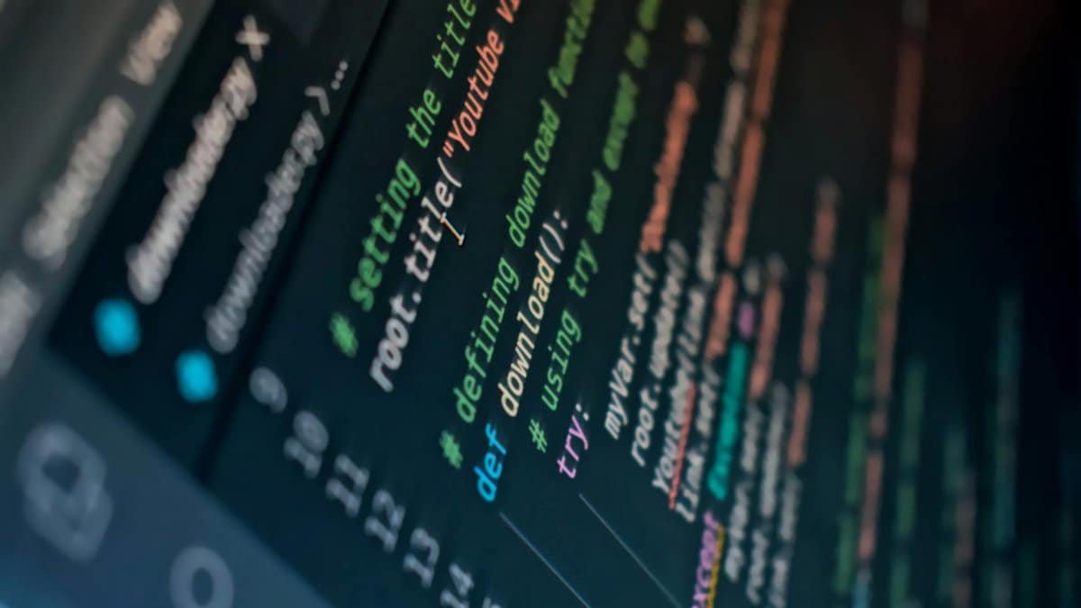 Detailed view of computer code highlighting syntax in colors on a screen.