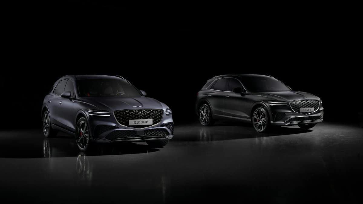 Two Genesis GV70 Sport SUVs showcased in a dramatic studio setting, highlighting luxury and design.