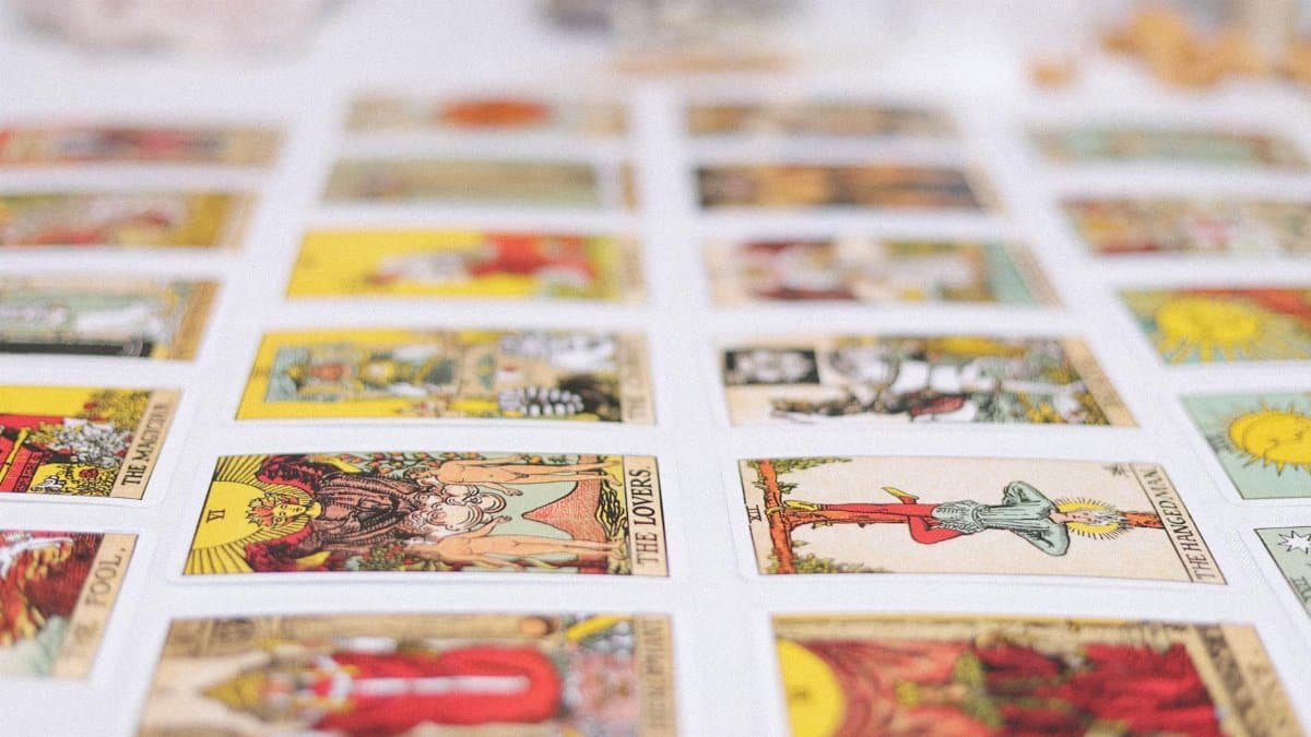 Vibrant spread of tarot cards laid out for an insightful reading session, showcasing various classic tarot designs.