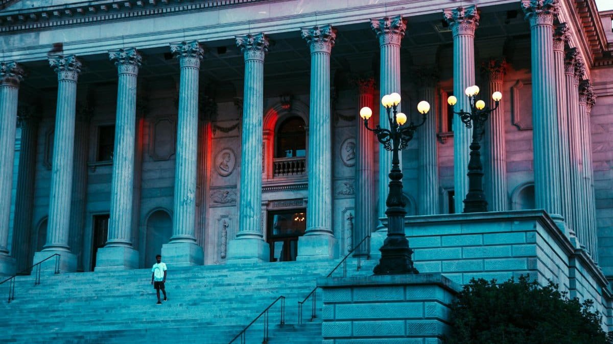 Captivating evening view of the South Carolina State House with grand columns and soft lighting.