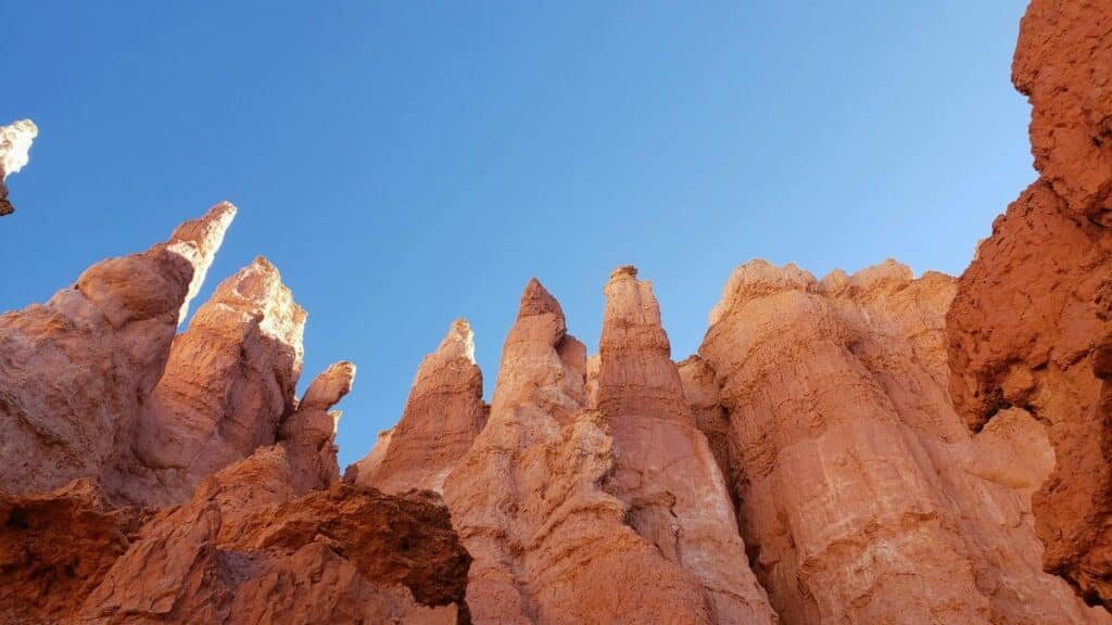 Majestic hoodoos under a clear blue sky in Bryce Canyon, Utah.
