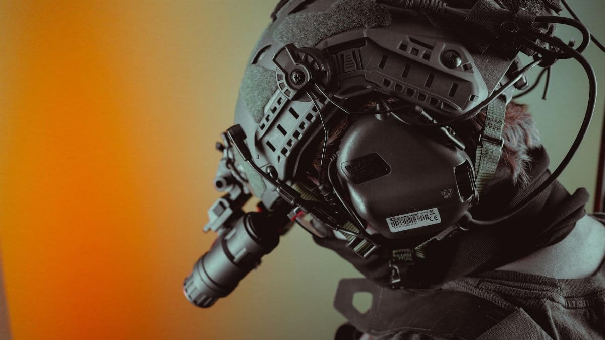 Close-up of a tactical helmet equipped with night vision gear, emphasizing technology.