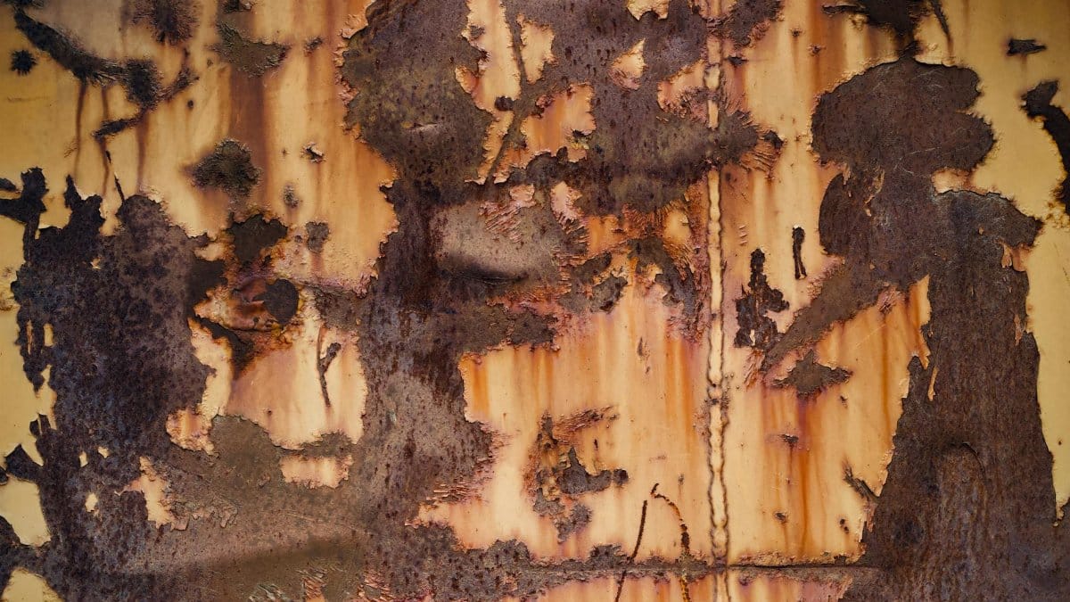 Close-up of a rusty metal surface with unique abstract patterns and textures.