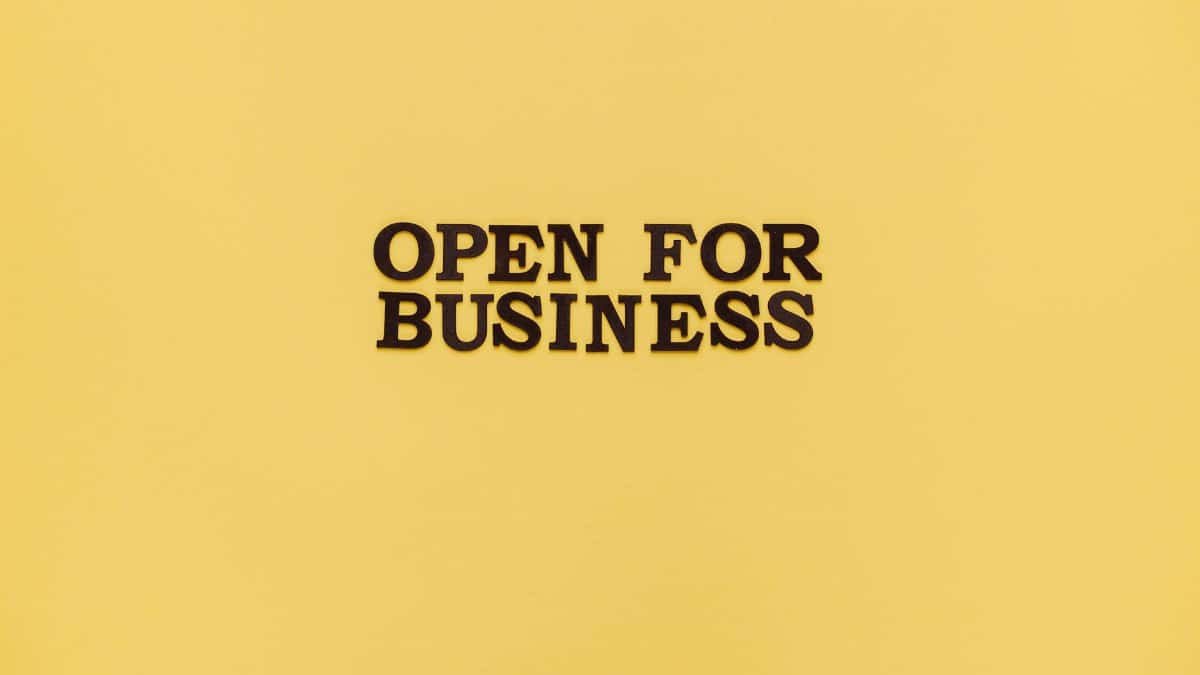 Bold 'Open for Business' text on a vibrant yellow background for advertising.