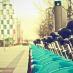A row of bicycles in a modern city street, perfect for sustainable urban life.