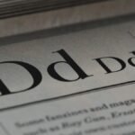 Detailed close-up of a newspaper showing typography and lettering design.