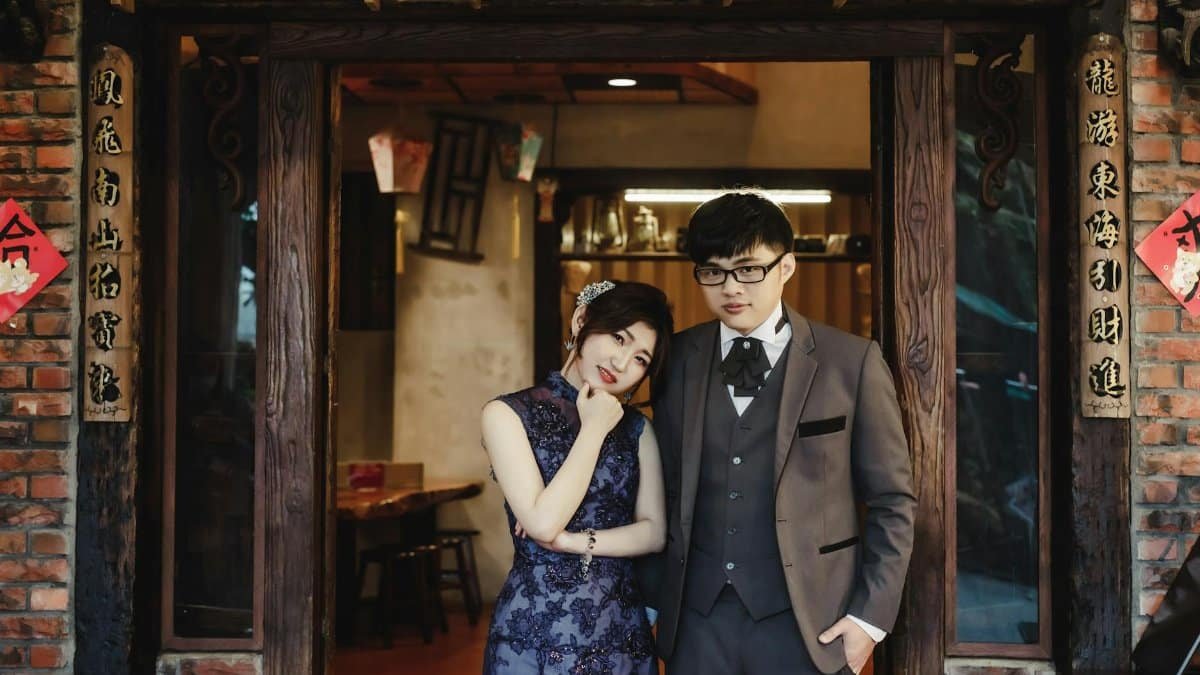 Beautiful Asian couple posing in traditional attire during a wedding photoshoot in Taiwan.