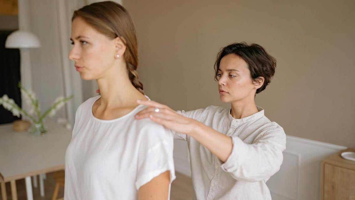 Adult women receiving a therapeutic massage in a calm indoor setting, promoting wellness and relaxation.