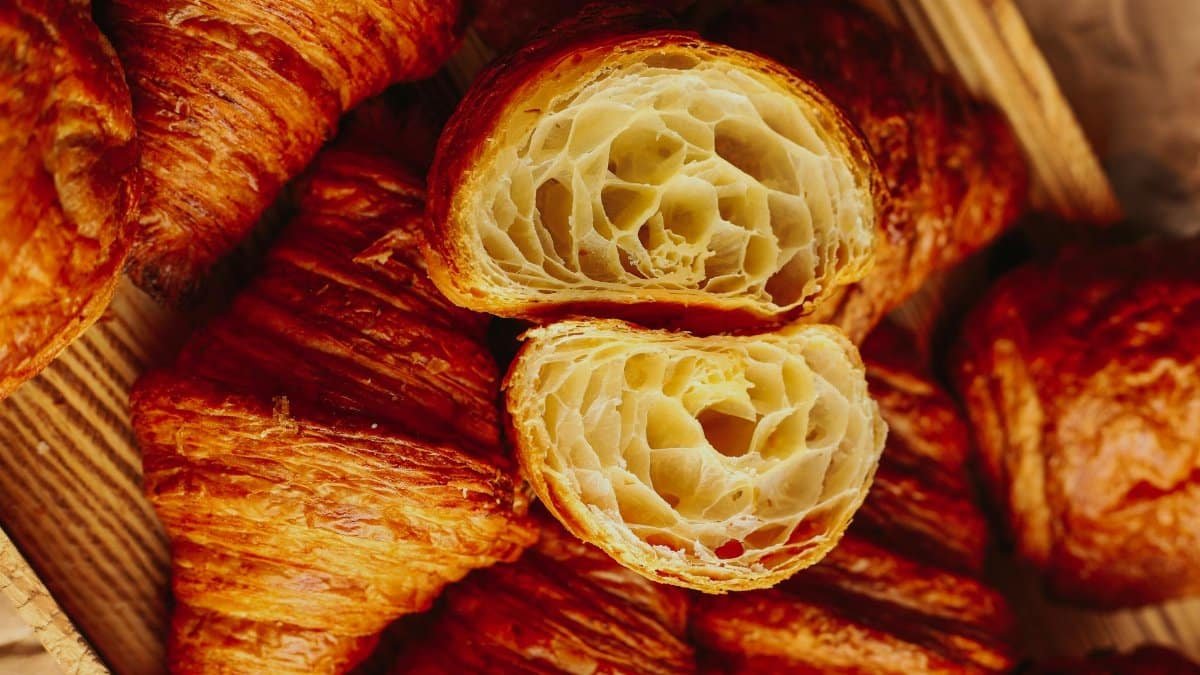 Delicious freshly baked croissants, golden and flaky, perfect for breakfast or brunch.
