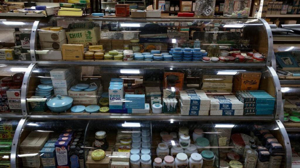 A nostalgic display of vintage products inside a retro-style store, showcasing old-fashioned packaging and design.