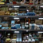 A nostalgic display of vintage products inside a retro-style store, showcasing old-fashioned packaging and design.