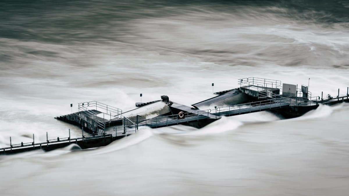 An aerial view of a structure overwhelmed by a river flood in Bern, Switzerland.