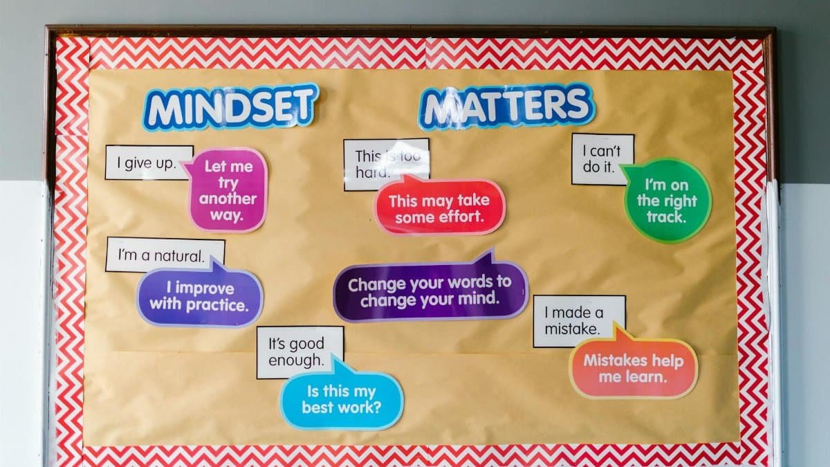 Colorful educational bulletin board with positive mindset messages for students.