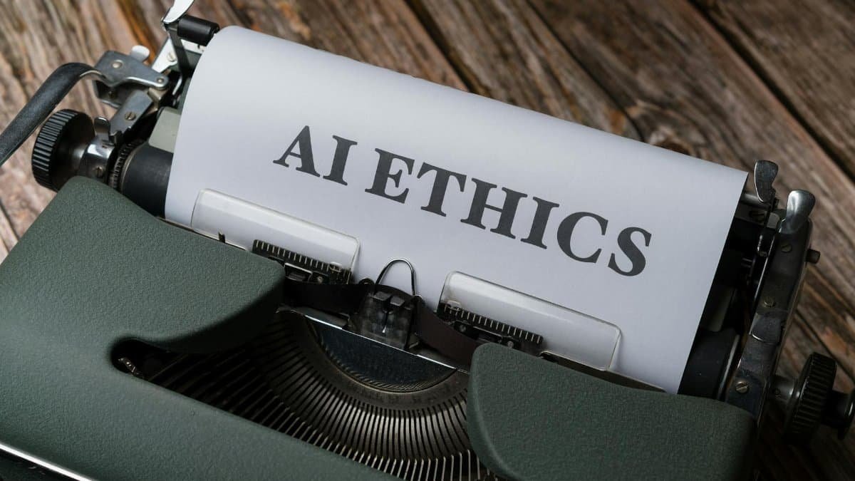 Retro typewriter with 'AI Ethics' on paper, conveying technology themes.
