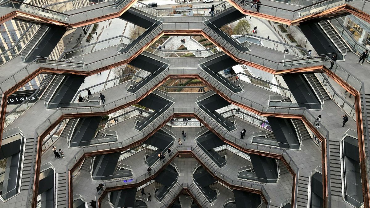 Stunning aerial shot of the Vessel's intricate staircases in NYC, a modern architectural landmark.