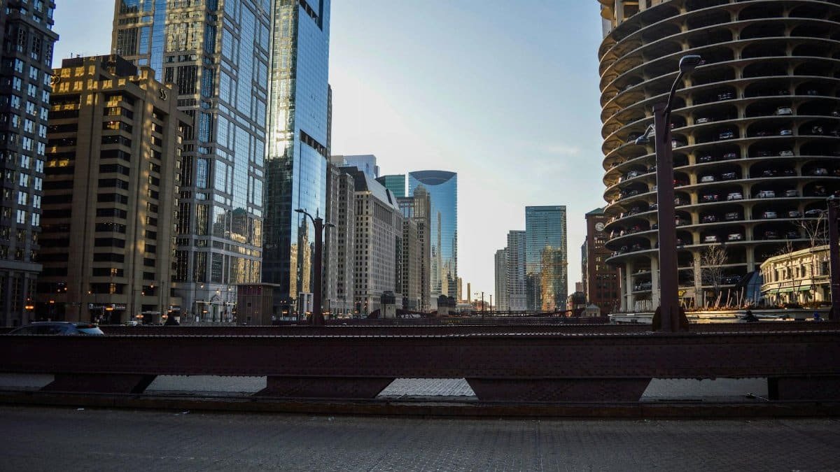 Stunning view of Chicago's modern skyline from a city bridge, featuring iconic skyscrapers.