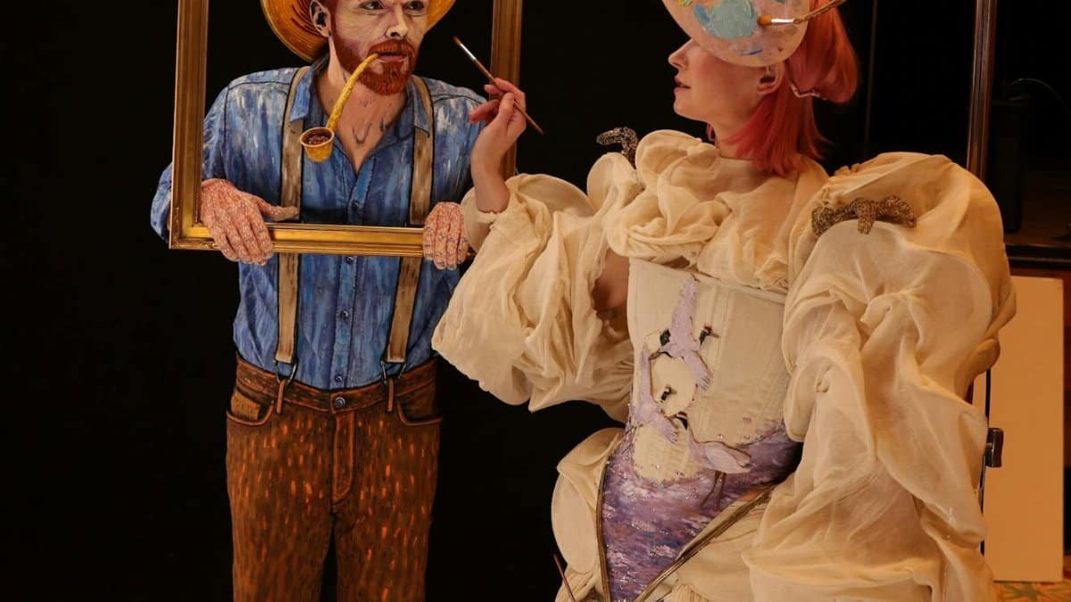 Artistic portrait combining a painting and a person in creative costume. Dynamic view.