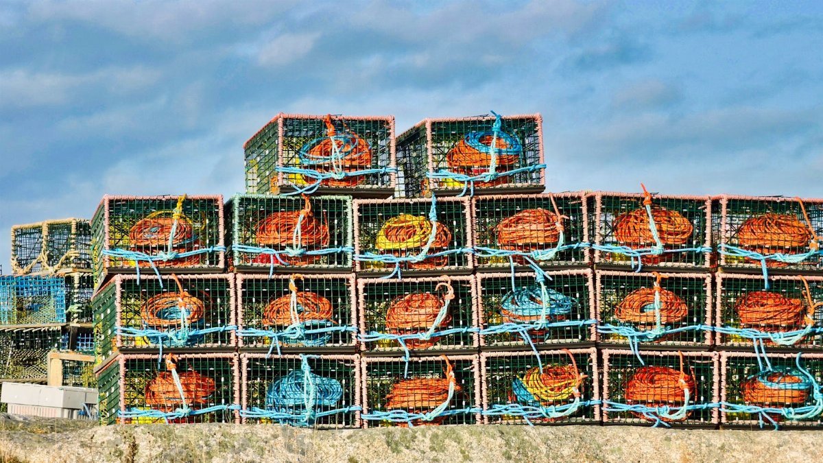 Colorful lobster traps piled at scenic Peggy's Cove in Nova Scotia, Canada.