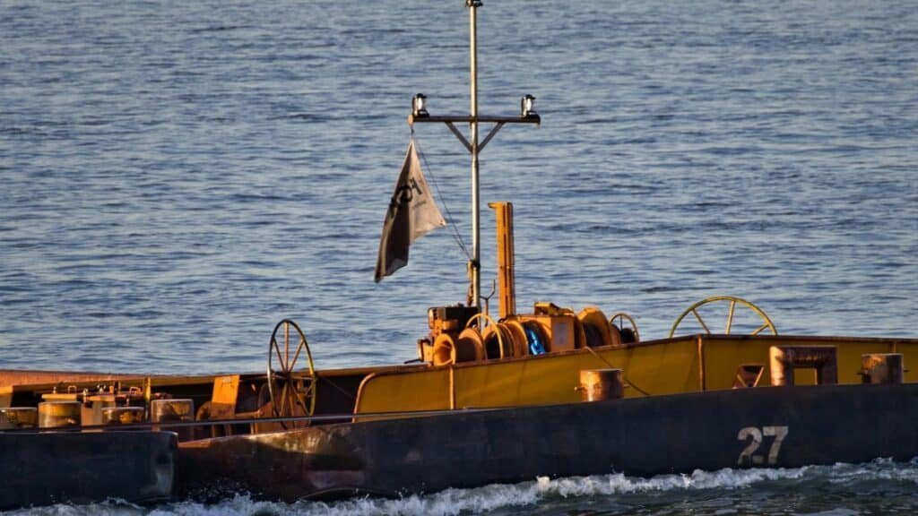 A pusher boat on an inland waterway, highlighting transportation and logistics.