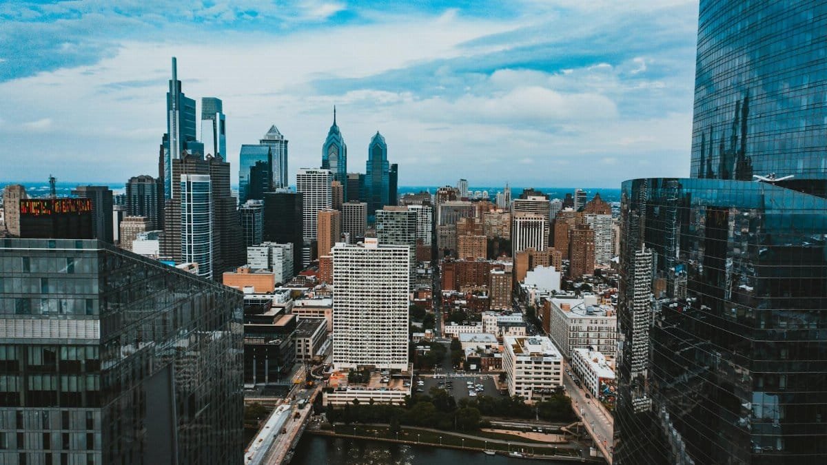 Drone view of modern exterior of apartment buildings with glass mirrored facades located in big city of Philadelphia