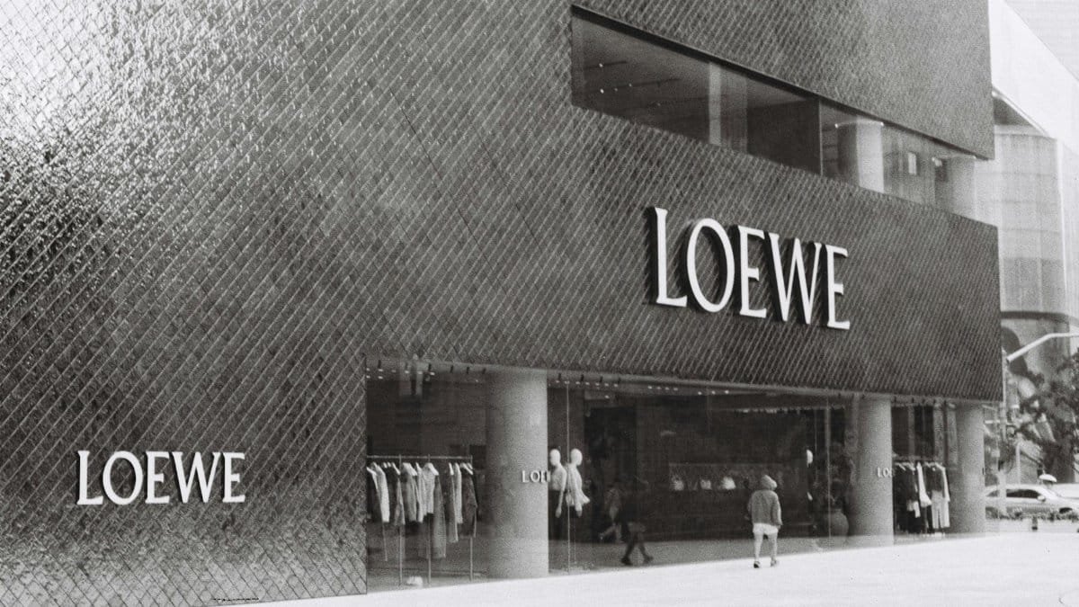 Stunning Loewe store exterior showcasing modern architecture with stylish clothing displays.