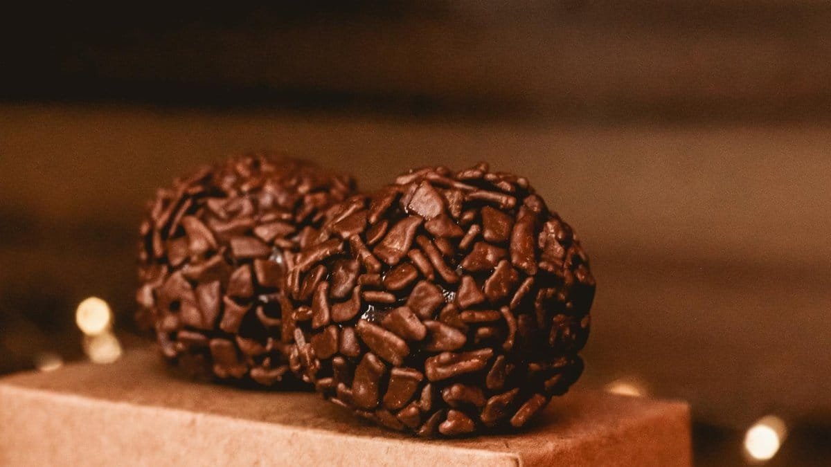 A close-up view of rich chocolate brigadeiros, a classic Brazilian dessert delight.
