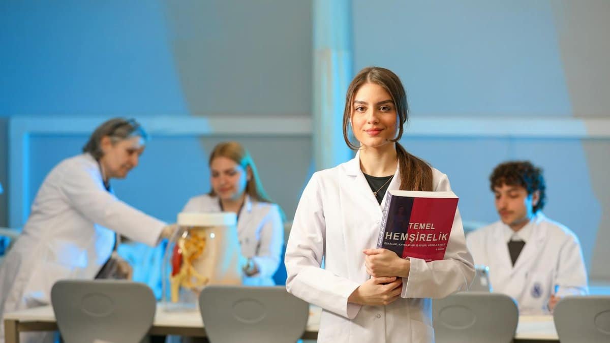 Young nursing students engaging in lab study, showcasing medical education.