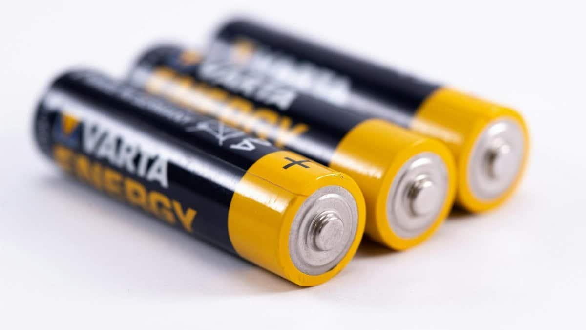 High-quality image showcasing a close-up view of three alkaline batteries on a white surface.