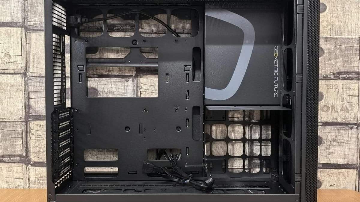 Black open computer case with visible interior and geometric design, ideal for DIY builds.