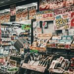 Vibrant display of a drugstore shopfront in Japan, showcasing a variety of products and sale signs.