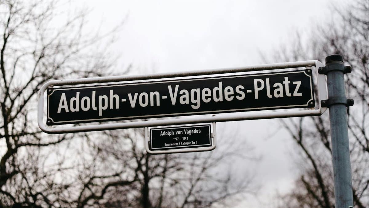 Street sign showcasing Adolph von Vagedes Platz, a historic location in Düsseldorf, Germany.