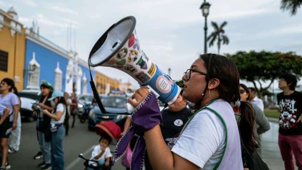A passionate speaker using a megaphone during a street protest in Trujillo, Perú.