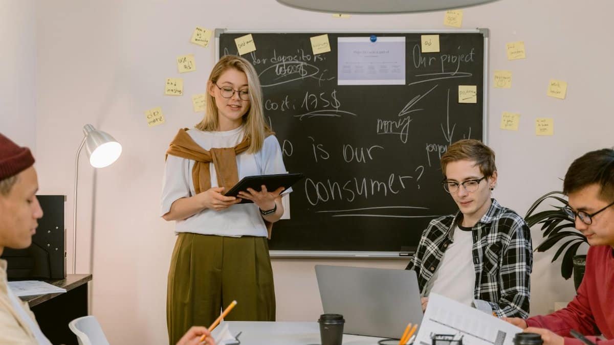 A diverse team collaborates on consumer insights in a modern office setting, showcasing teamwork and innovation.