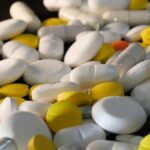 A close-up shot of various capsules and tablets, illustrating healthcare and medication concepts.