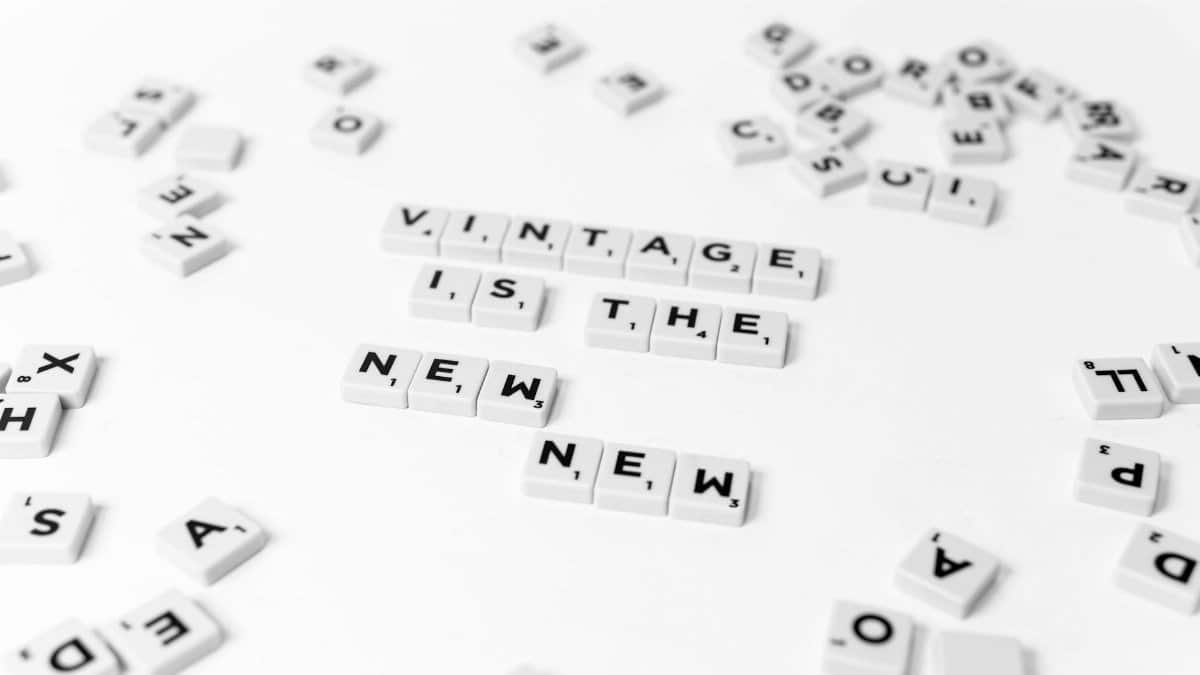Scrabble tiles on a white background spell out 'Vintage is the New.'