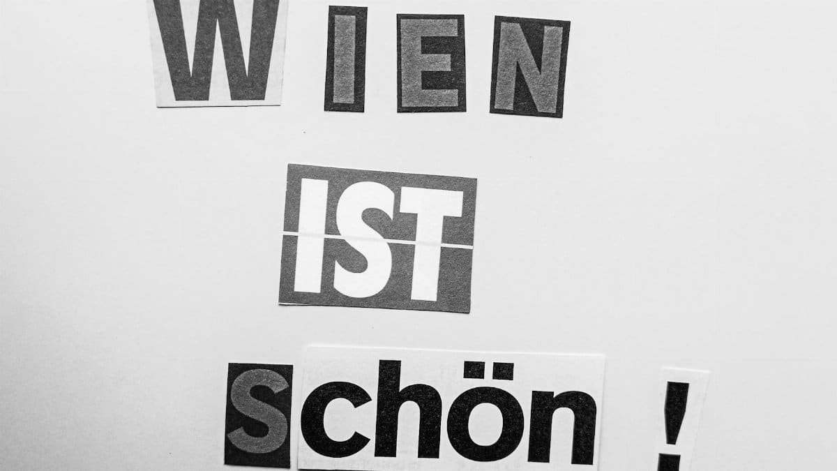 Creative typography art featuring the phrase 'Wien ist schön!' in black and white.