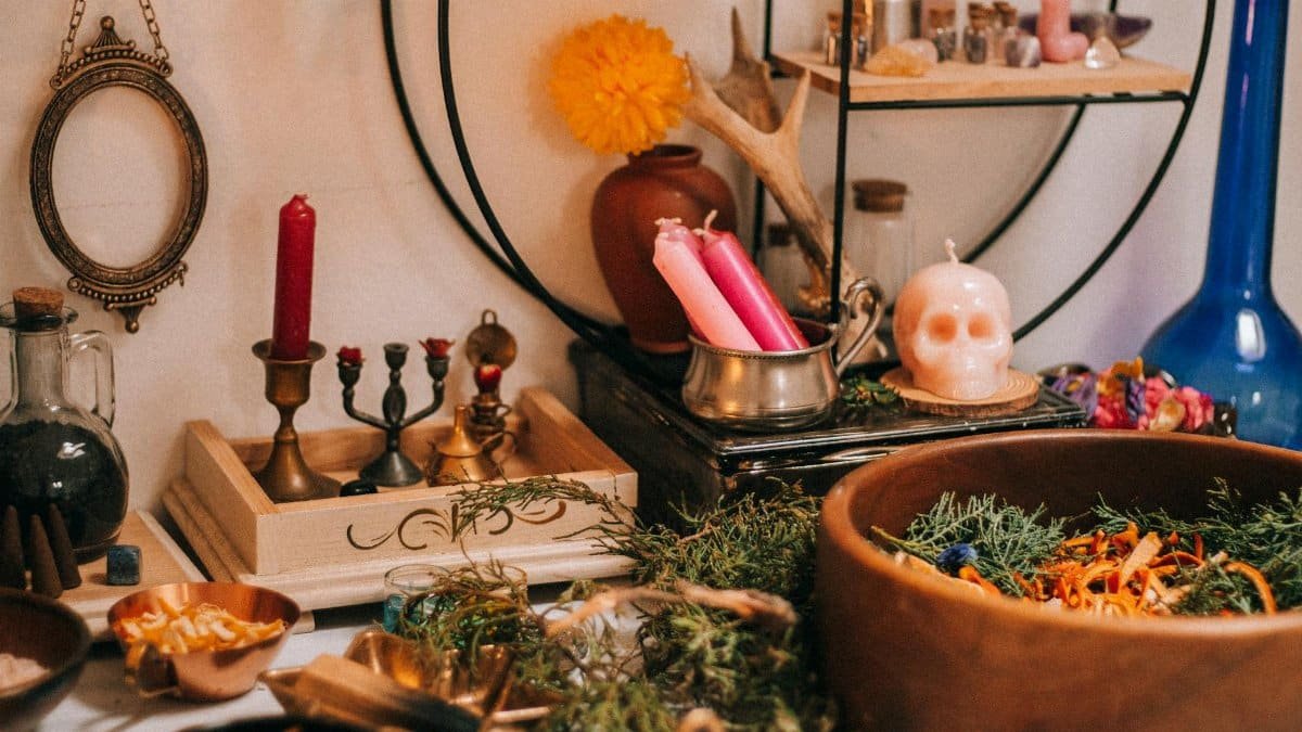 A mystical home altar featuring candles, herbs, and artifacts for a magical ambiance.