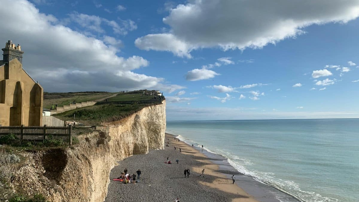 Explore the breathtaking Seven Sisters cliffs on a sunny day in Sussex, England.