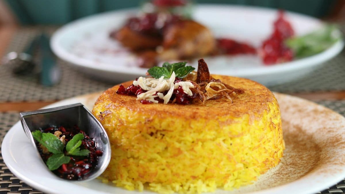 Savor the taste of Persian cuisine with this beautifully plated saffron rice dish, perfect for dinner.