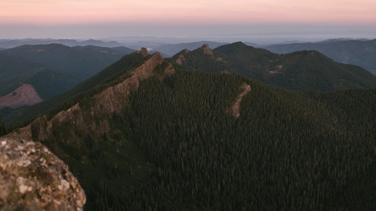 Breathtaking view of a mountain range at sunrise, capturing the natural beauty of Mount Rainier National Park.