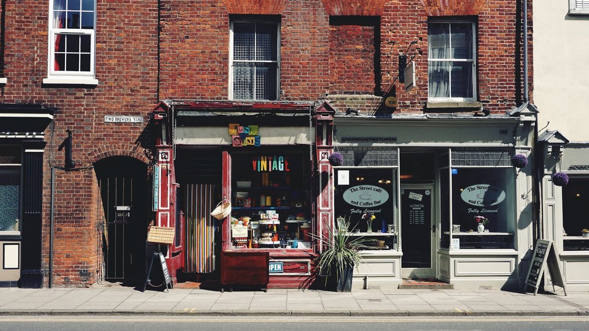A vibrant vintage shop and café on an old street in Norwich.
