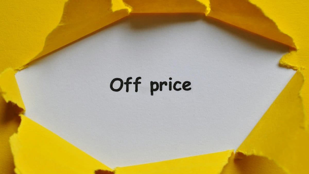 Yellow paper torn open to reveal 'Off Price' text, perfect for sales and discounts concept.