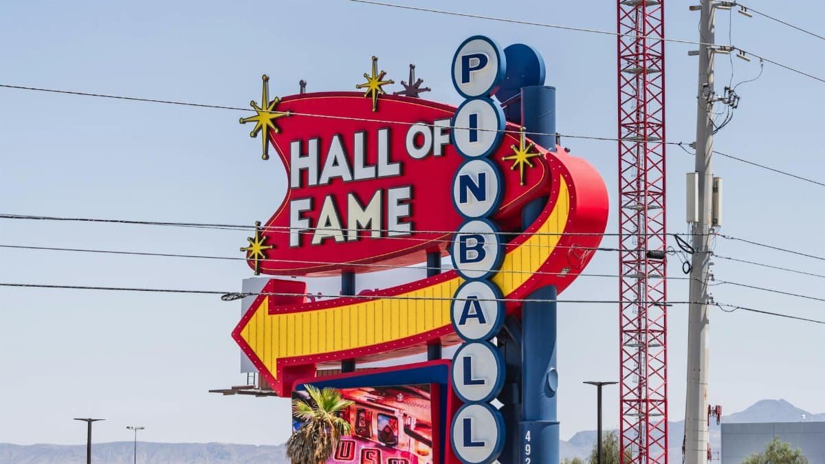 Vibrant sign of the Pinball Hall of Fame in Las Vegas, Nevada, captured outdoors in daylight.