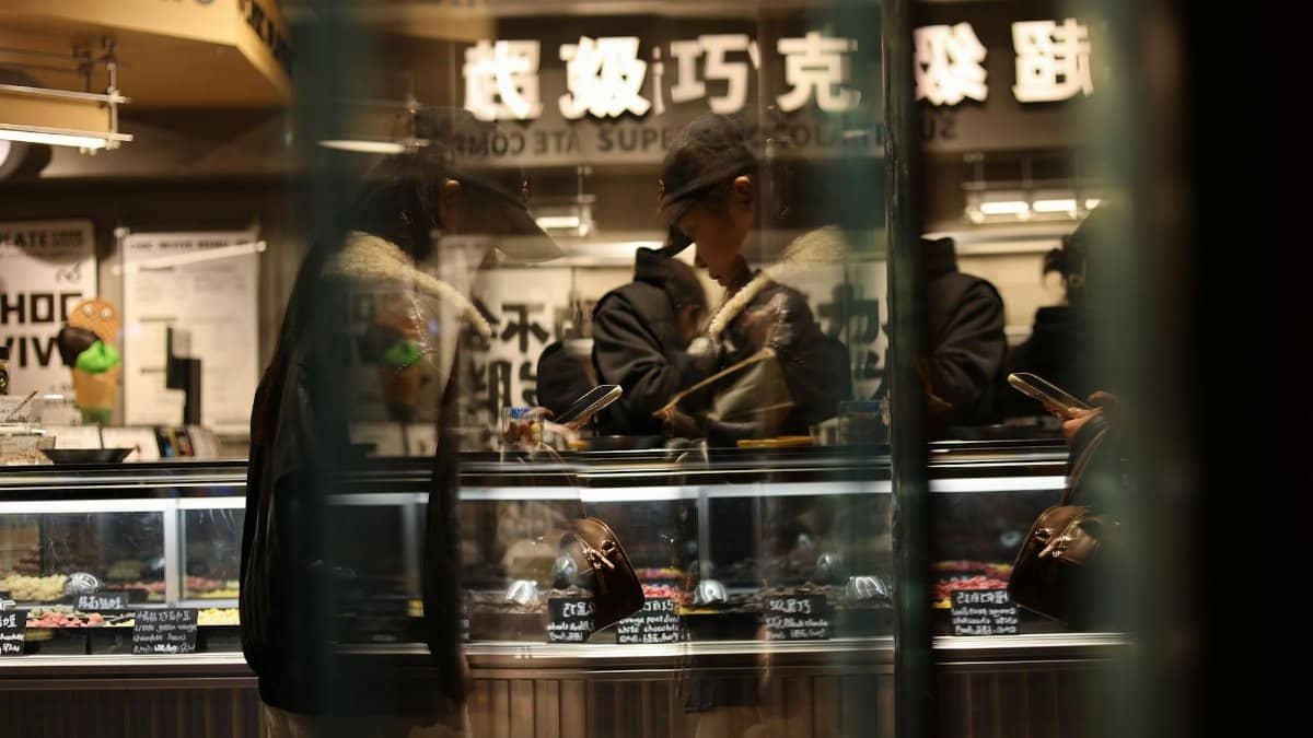 Candid moment in a Nanjing gelato shop, capturing everyday street life in a Chinese city.