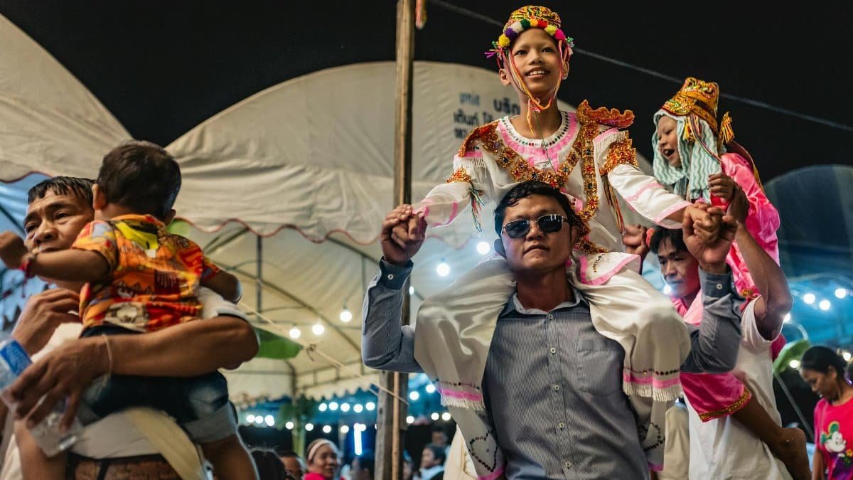 Joyful celebration at a traditional festival in Bangkok, Thailand.