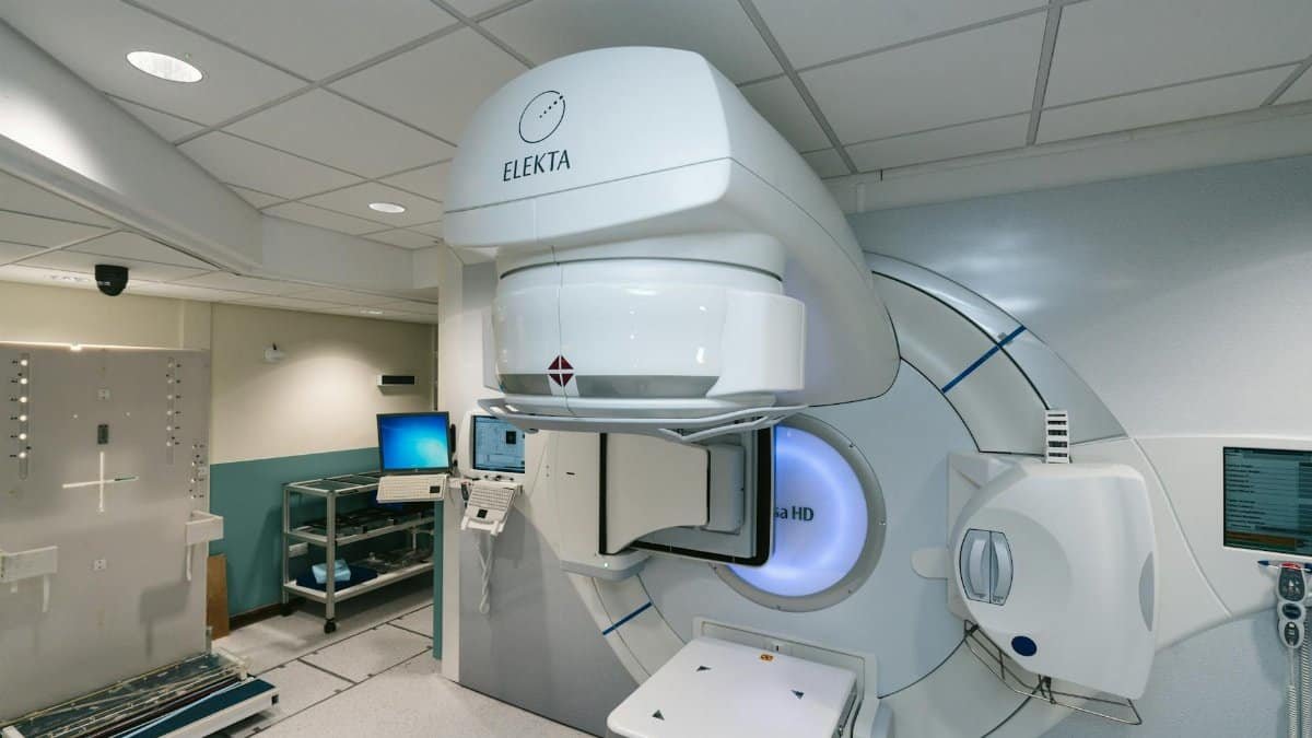 High-tech radiotherapy machine in a hospital setting, essential for cancer treatment.