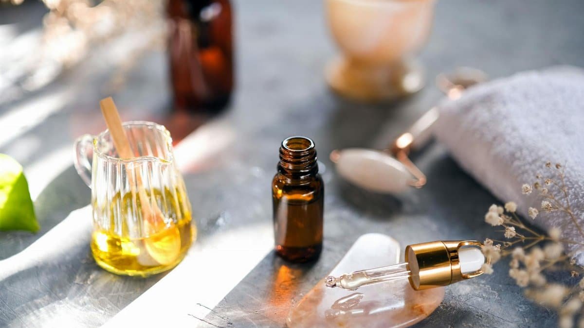 Aromatic oils and spa tools arranged on a table, perfect for relaxation.